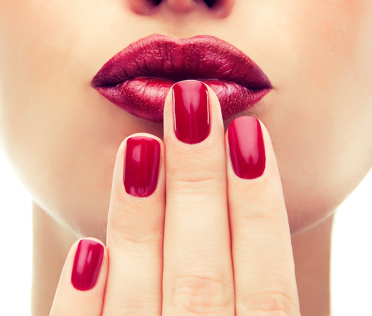 Deep wine lipstick coordinated with matching wine manicure — proof of nail + lipstick color pairing